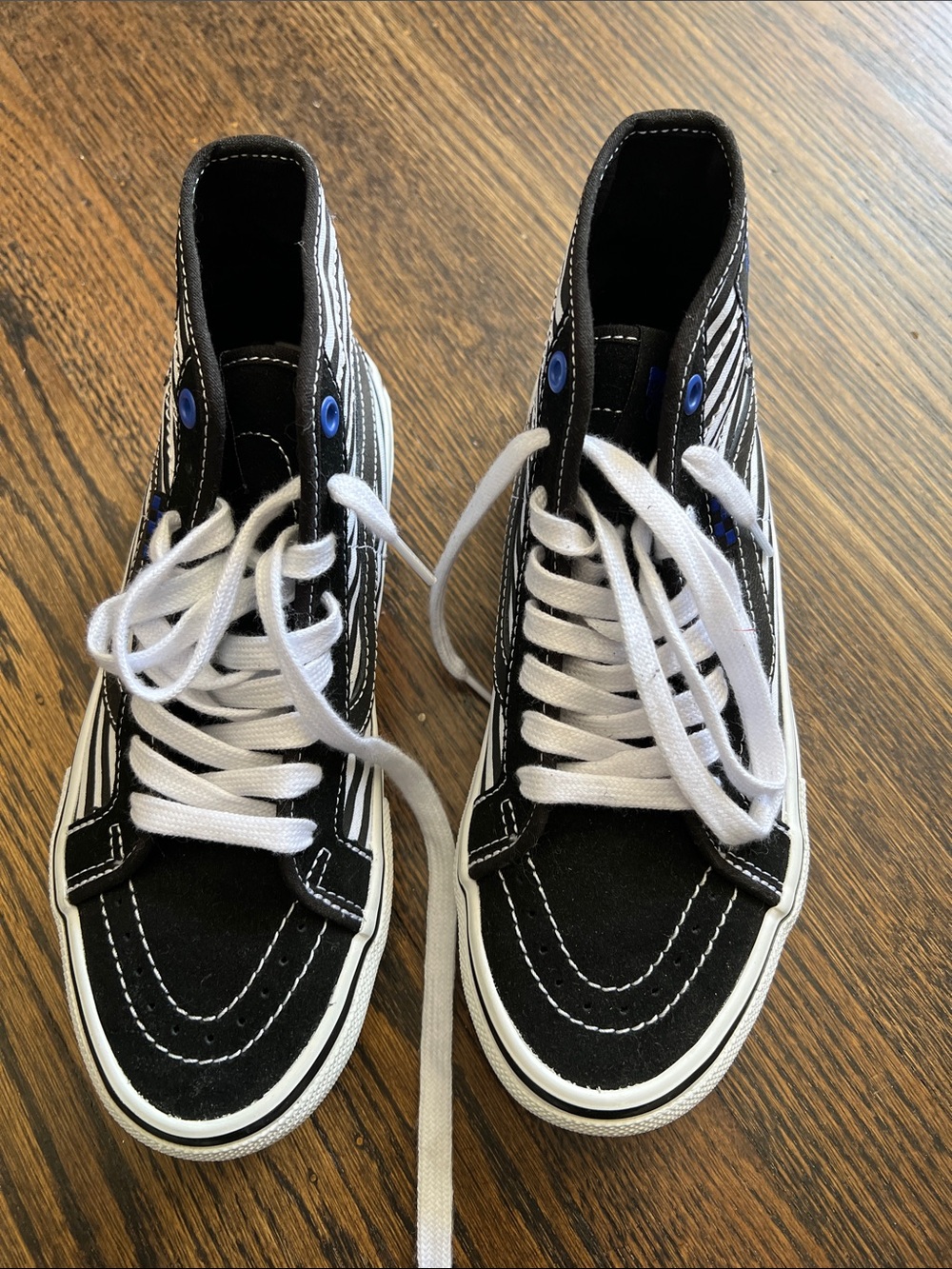Vans Black and White High-Top Athletic Shoes
